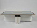 an image of a coffee table with a glass top and metal legs