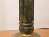 an image of a statue of a man on a pedestal on a table