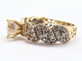 an image of a gold ring with diamonds on it