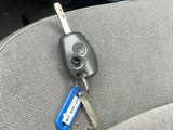 a car key that is attached to the back seat of a car