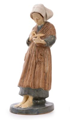 figurine of a woman holding a baby in her arms
