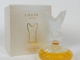 an image of a perfume bottle sitting next to a box on a table