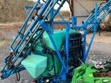 an image of a machine that is parked in the dirt