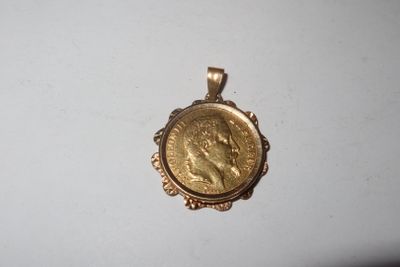 a gold coin with a woman ' s face on it