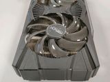 a close up of a video card on a table with a fan