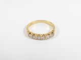 an image of a gold ring with three diamonds on it