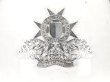 silver plated badge with a shield and stars on it