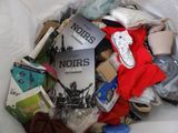 a pile of books and other items in a bag