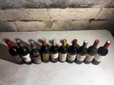 many bottles of wine lined up on a counter