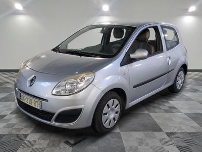 a picture of a small silver car parked in a garage