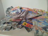 a pile of comic books sitting on a table