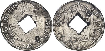 a silver coin with a hole in the middle of it
