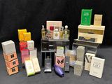 many different types of perfumes and boxes on the table