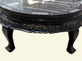 a black table with a glass top on a white background
