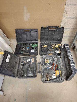 many tools in a case sitting on the floor