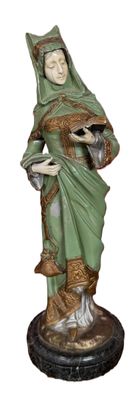 figurine of a woman holding a tray of food in her hands