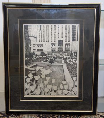 a black and white photo of a framed picture of a garden