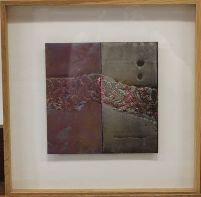 framed photograph of a piece of art on display in a wooden frame