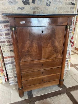 a wooden cabinet with a drawer on top of it