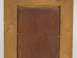 an old wooden picture frame with a small square in the middle