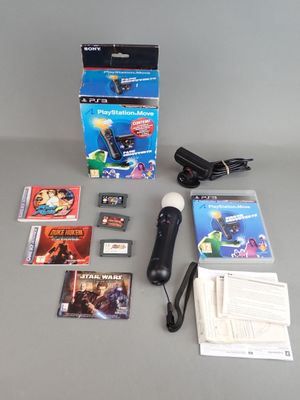 nintendo wii game system with accessories including a microphone, game cards, and a charger