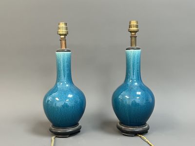 pair of blue ceramic table lamps with brass fittings on bases