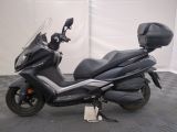 a picture of a motorcycle parked on a checkered floor