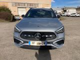 the front view of a silver mercedes cla parked in a parking lot