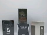 four different types of perfumes in boxes on a white background