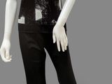 an image of a mannequin wearing a black and white top and pants