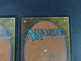 two decks of magic the gathering are shown on a table