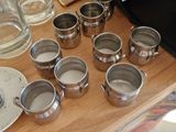 a wooden table with a bunch of cups and plates on it
