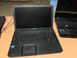 two laptops that are sitting on a table