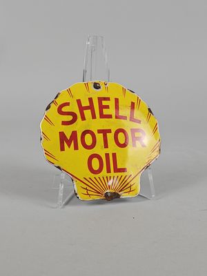 yellow shell motor oil sign on clear acrylic stand