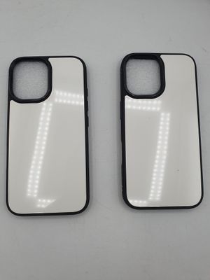 two white and black iphone cases sitting side by side on a table