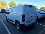 a white van that is parked in a parking lot