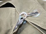a close up of a pair of scissors sticking out of a jacket