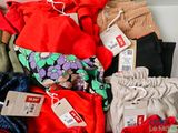 a pile of clothing that is sitting on a table