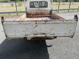a white truck that is parked on the side of the road