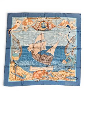 an image of a blue and white square scarf with a picture of a ship