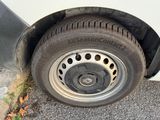 a close up of a tire on the side of the road