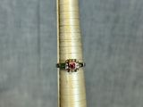 a close up of a ring on top of a gold cone