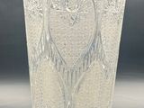 an image of a clear glass vase sitting on top of a table