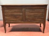 an old wooden chest with two drawers and a drawer underneath it