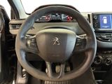 the interior of a car with a steering wheel and dashboard controls