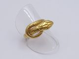 an image of a gold ring with a snake ' s head on it