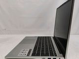an open laptop computer sitting on top of a white table