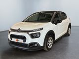 the white citrole is parked in a large room