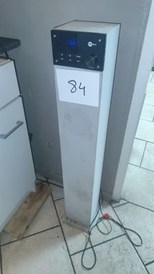 an image of a water dispenser in the corner of a kitchen