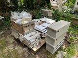 a pile of boxes and boxes sitting on the ground